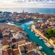 Aerial view of Venice, Italy, showcasing its iconic canals, bridges, and historic architecture