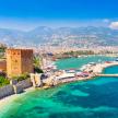 Alanya, Turkey, featuring its colorful cityscape, beaches, azure waters, and the Alanya Castle on a sunny day