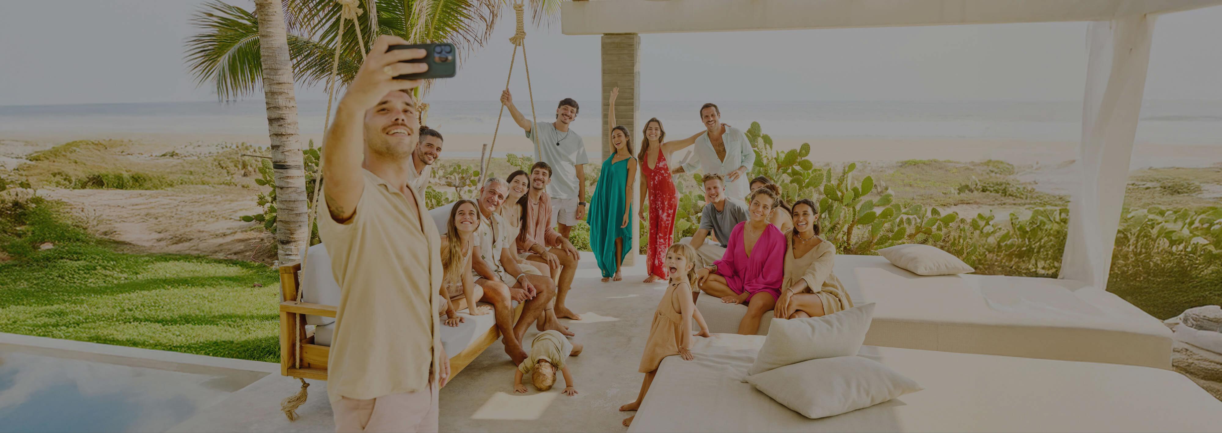 A family group takes a selfie on their tropical vacation